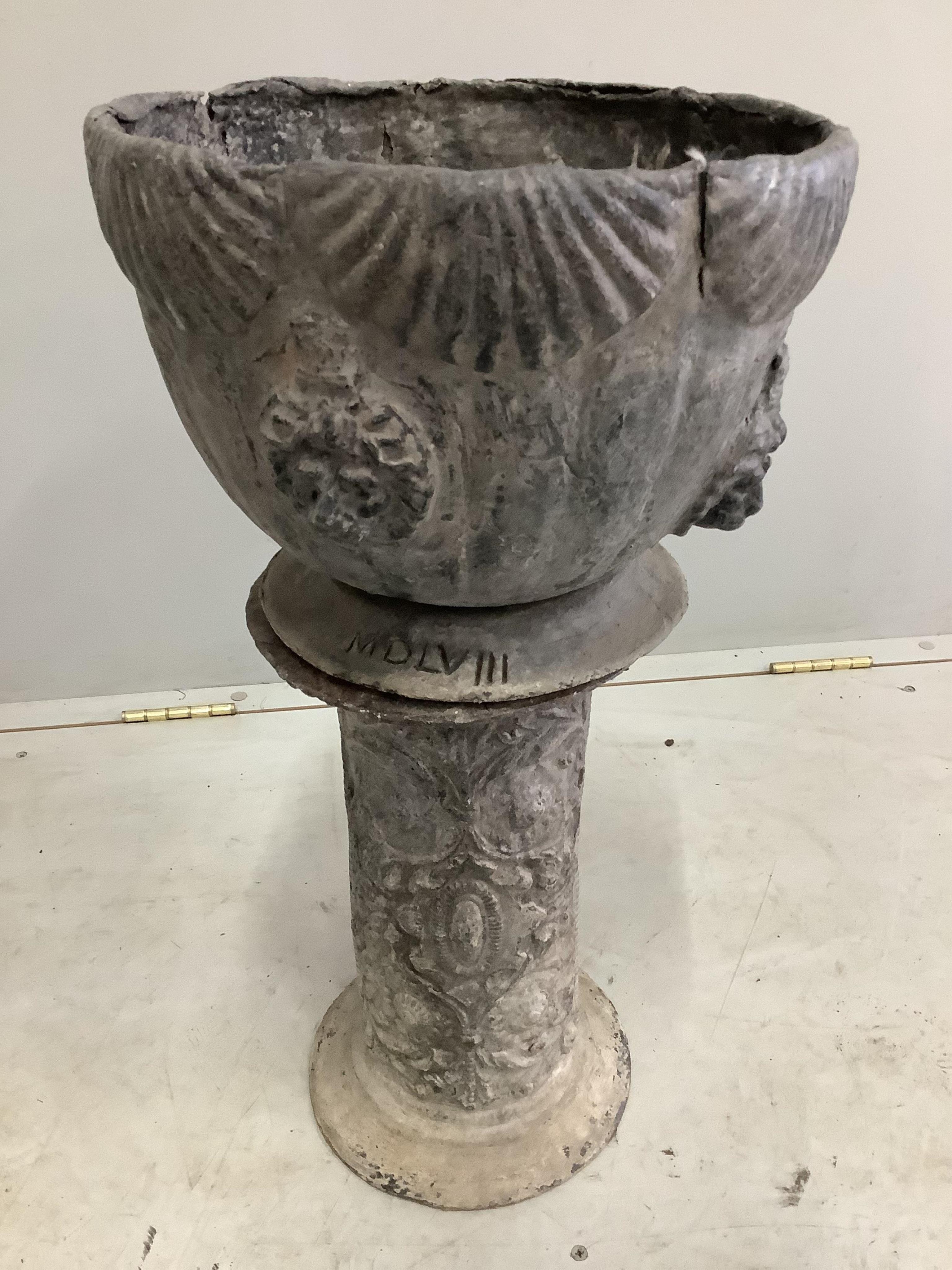 An Edwardian lead jardiniere with lions mask decoration standing upon a lead pedestal, diameter 33cm, height overall 61cm. Condition - fair to good